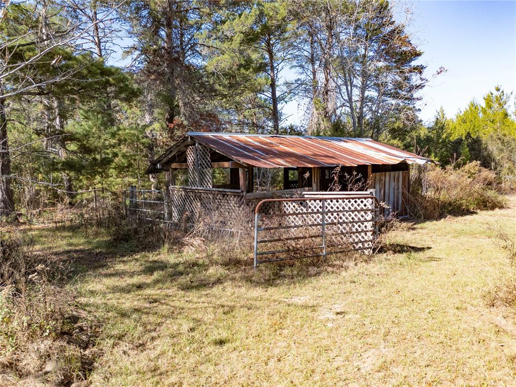 18129 Southwest 200th Street Archer, FL 32618 - Photo 12 of 24 a front view of a house with a yard