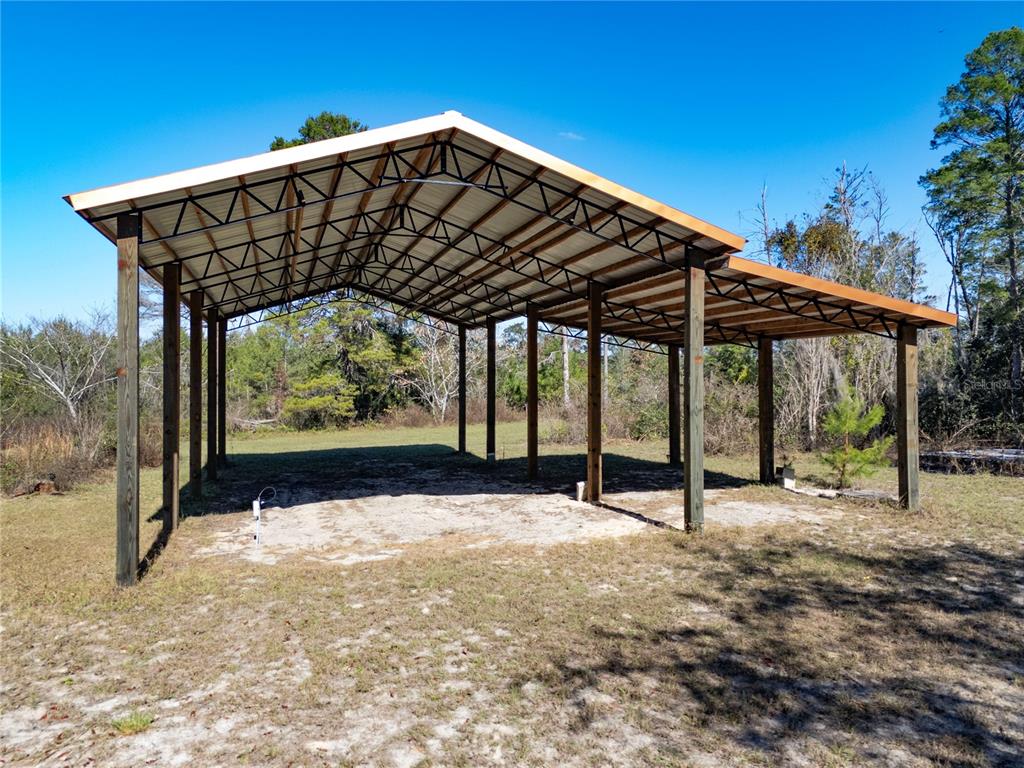 18129 Southwest 200th Street Archer, FL 32618 - Photo 2 of 24 a view of a roof deck