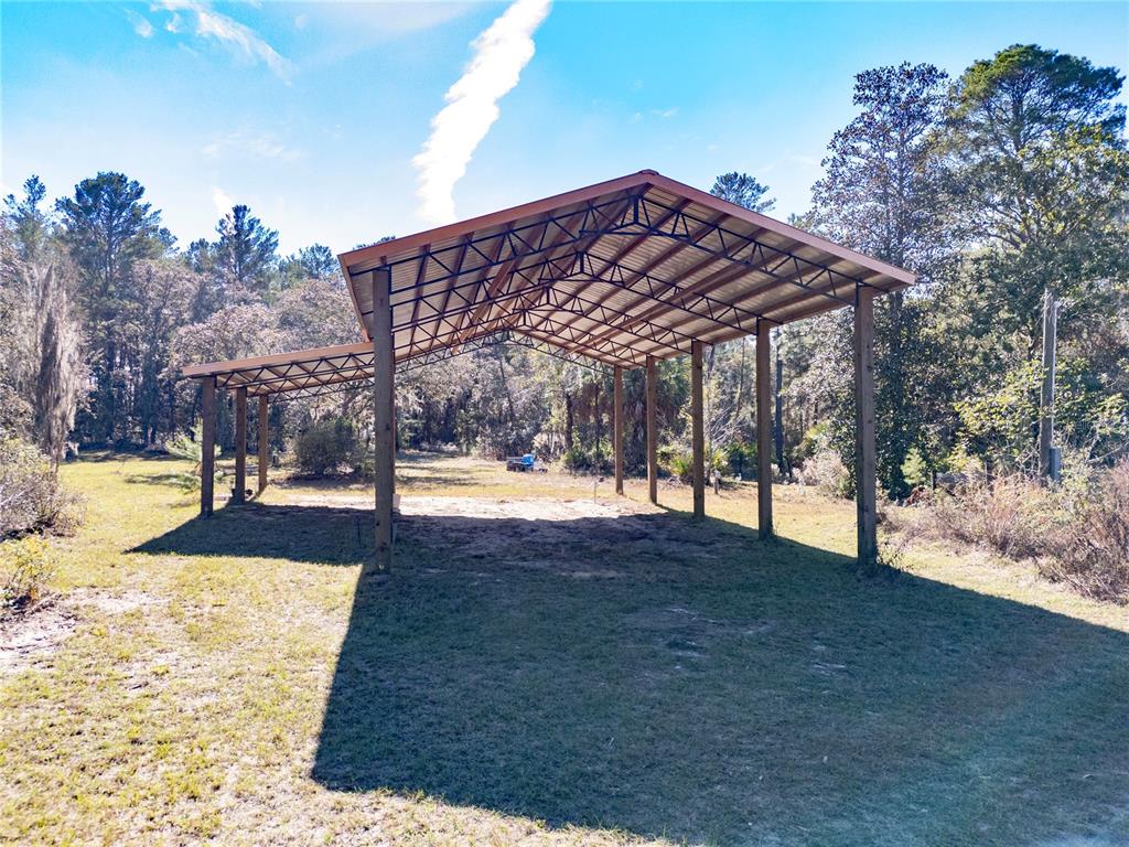 18129 Southwest 200th Street Archer, FL 32618 - Photo 3 of 24 a view of outdoor space yard and swimming pool