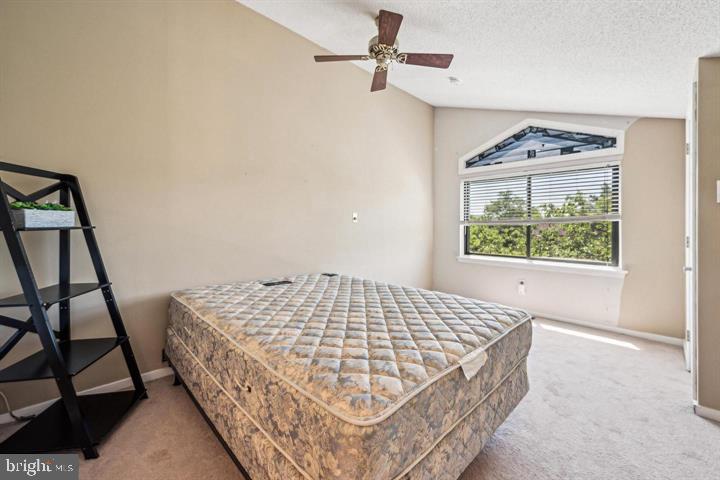 502 Gregorys Way Voorhees, NJ 08043 - Photo 5 of 8 a living room with a bed furniture and a window
