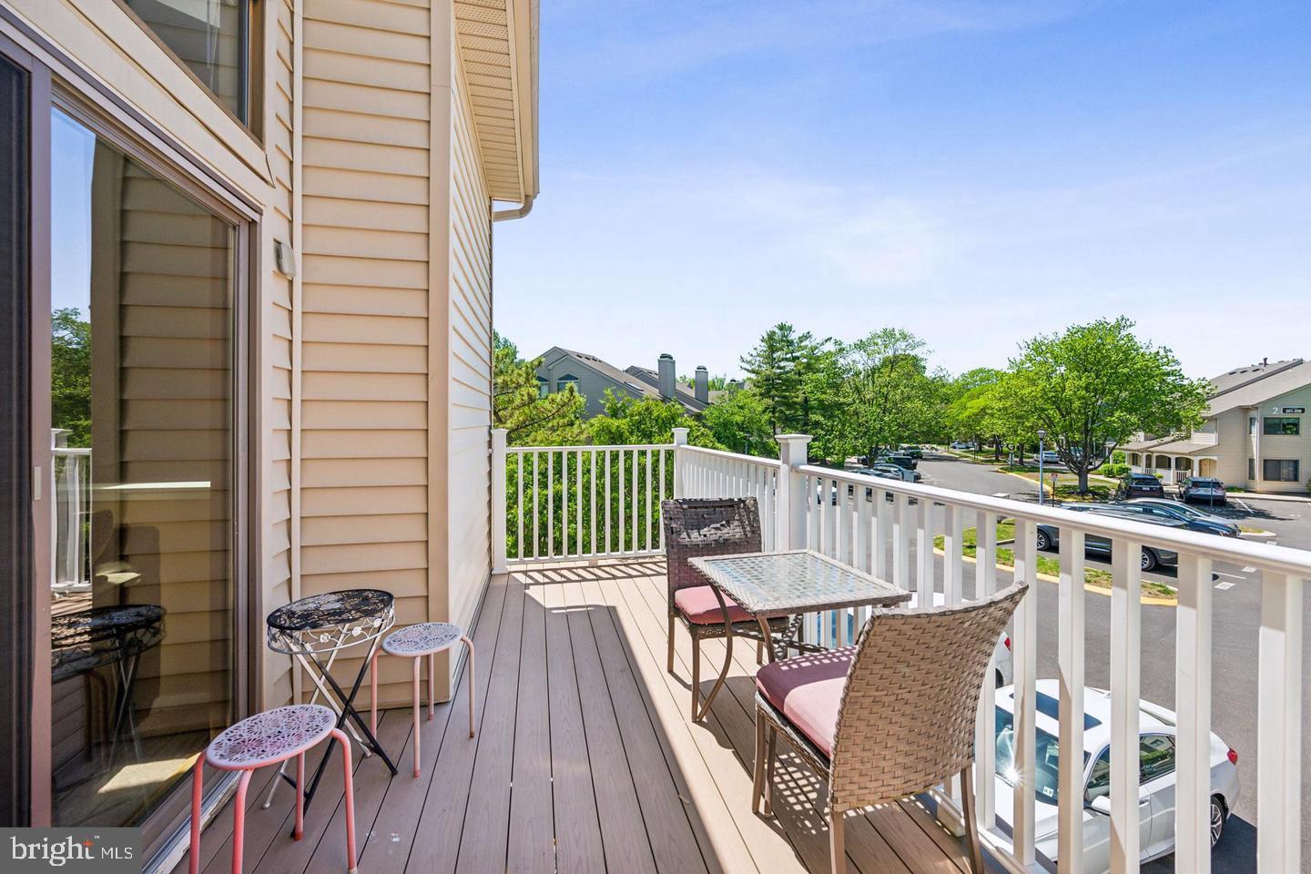 502 Gregorys Way Voorhees, NJ 08043 - Photo 8 of 8 a view of a chair and table on the deck