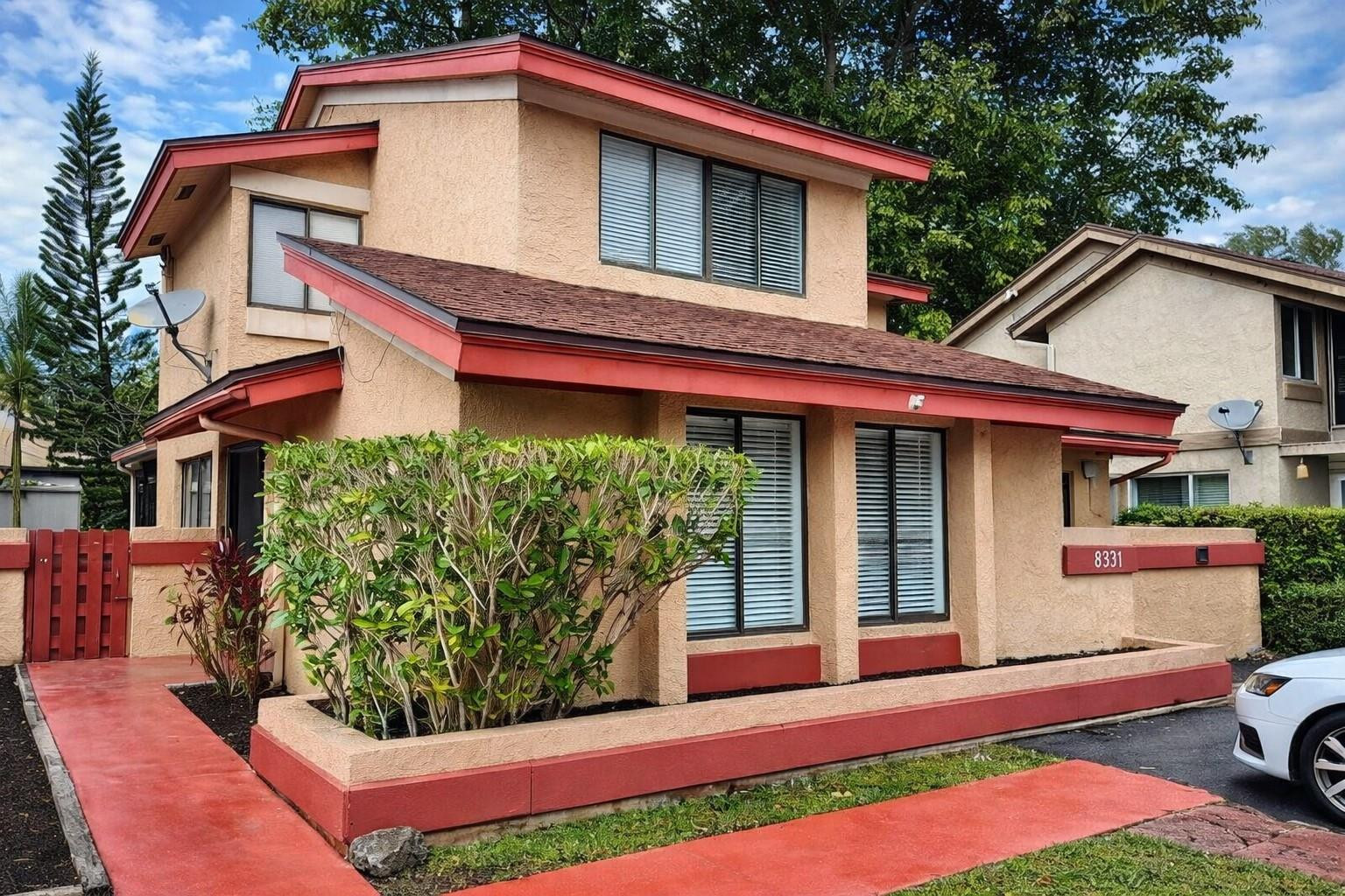 8331 Southwest 39th Court, Unit 8331 Fort Lauderdale, FL 33328 - Photo 1 of 44 a front view of a house with a yard