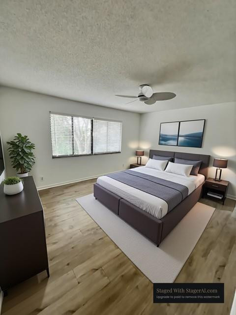 8331 Southwest 39th Court, Unit 8331 Fort Lauderdale, FL 33328 - Photo 21 of 44 a spacious bedroom with a bed and a potted plant