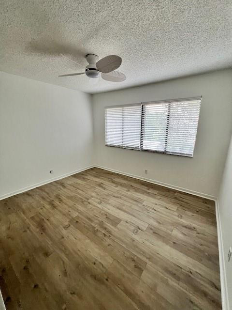 8331 Southwest 39th Court, Unit 8331 Fort Lauderdale, FL 33328 - Photo 23 of 44 an empty room with wooden floor and windows