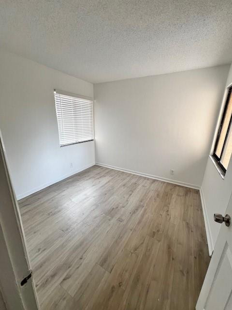 8331 Southwest 39th Court, Unit 8331 Fort Lauderdale, FL 33328 - Photo 26 of 44 an empty room with wooden floor and windows