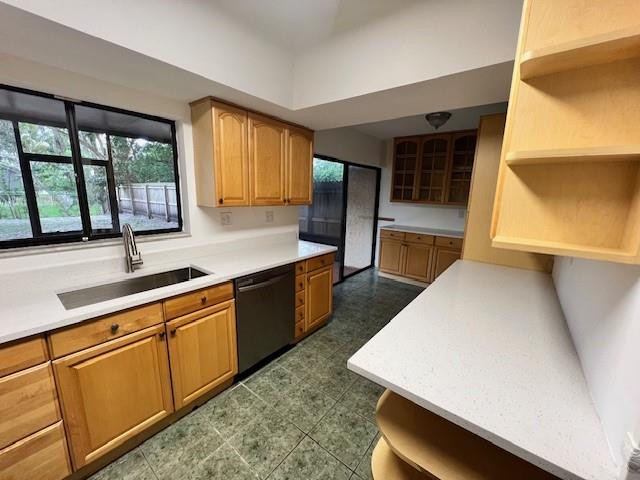 8331 Southwest 39th Court, Unit 8331 Fort Lauderdale, FL 33328 - Photo 3 of 44 a kitchen with stainless steel appliances wooden cabinets a sink and a large window