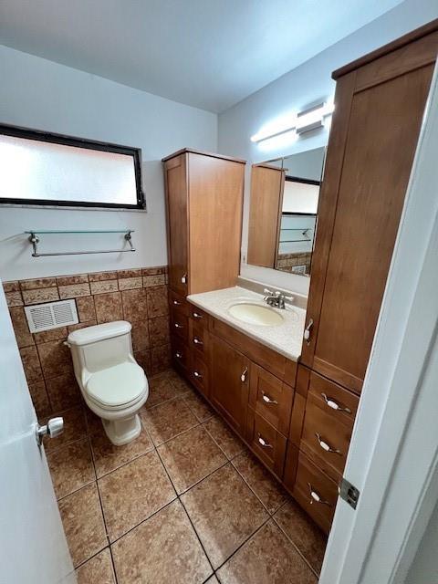8331 Southwest 39th Court, Unit 8331 Fort Lauderdale, FL 33328 - Photo 35 of 44 a bathroom with a toilet sink and mirror