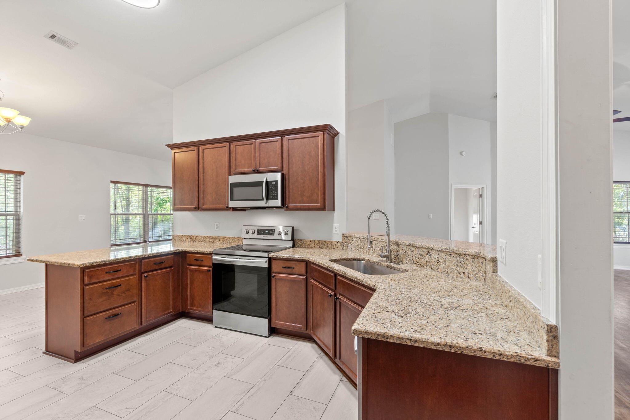 6000 Fiori Drive Crestview, FL 32539 - Photo 12 of 44 a kitchen with a sink and cabinets