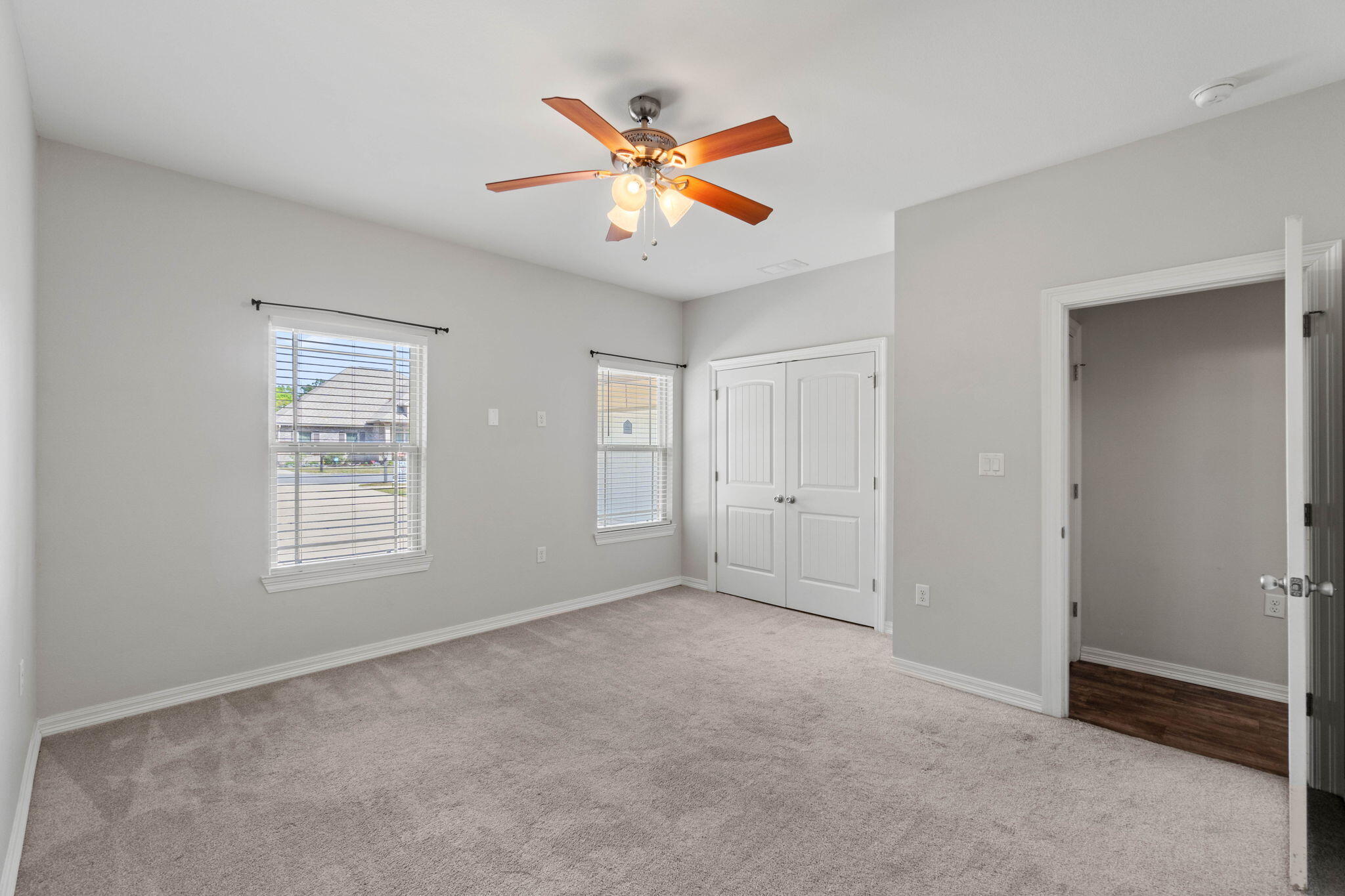 6000 Fiori Drive Crestview, FL 32539 - Photo 15 of 44 a view of an empty room with a ceiling fan and window