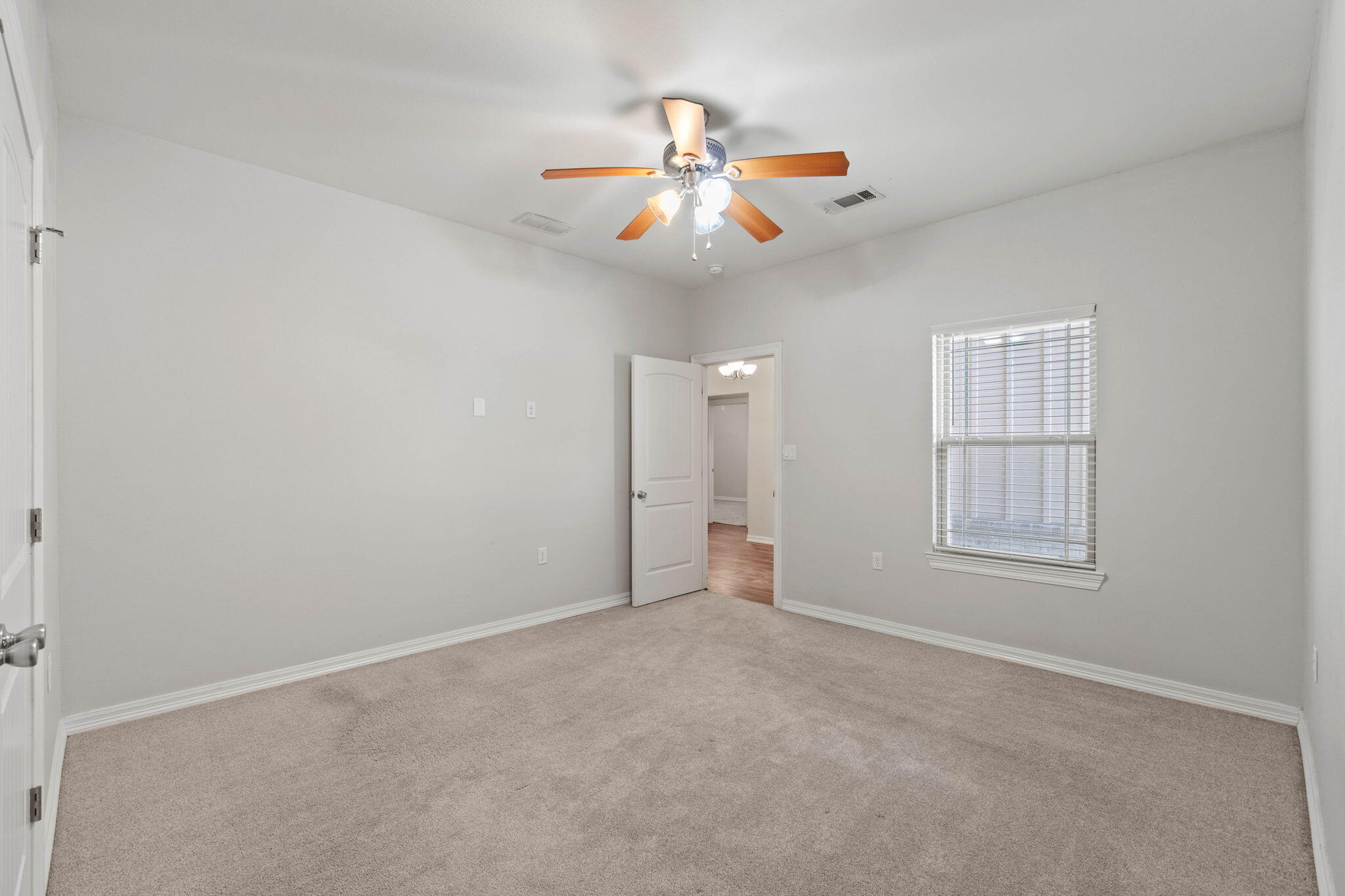 6000 Fiori Drive Crestview, FL 32539 - Photo 21 of 44 an empty room with windows and fan