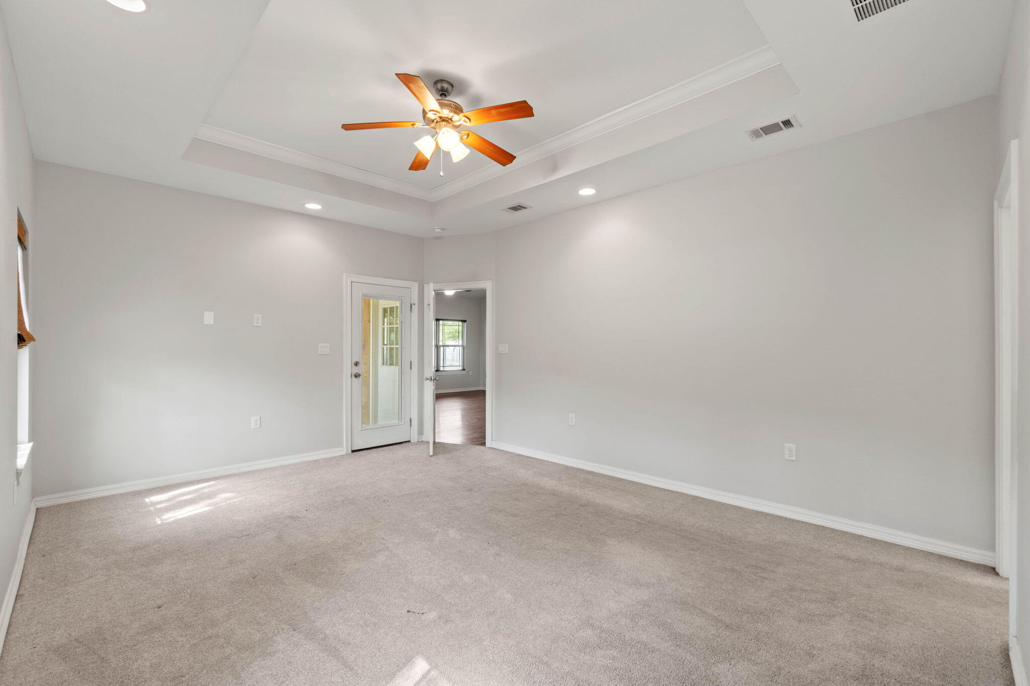 6000 Fiori Drive Crestview, FL 32539 - Photo 23 of 44 an empty room with chandelier fan and windows