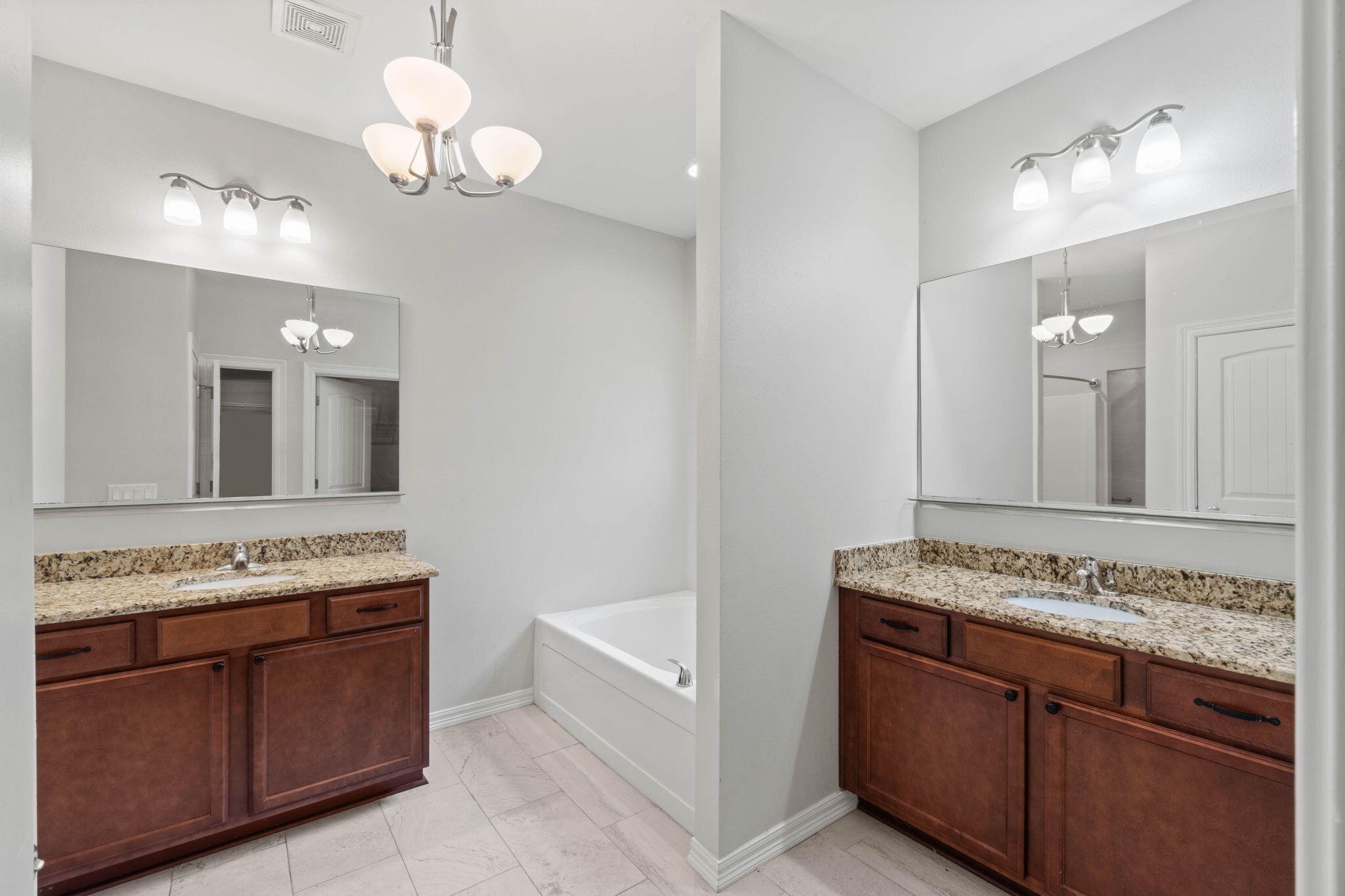 6000 Fiori Drive Crestview, FL 32539 - Photo 24 of 44 a bathroom with a granite countertop sink and a mirror