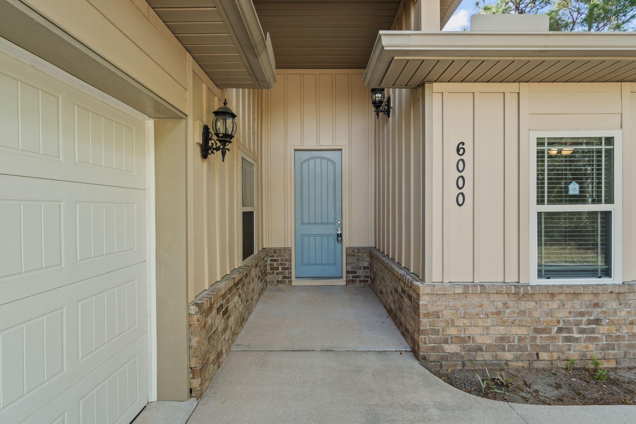 6000 Fiori Drive Crestview, FL 32539 - Photo 3 of 44 a view of a hallway with wooden floor and a shower