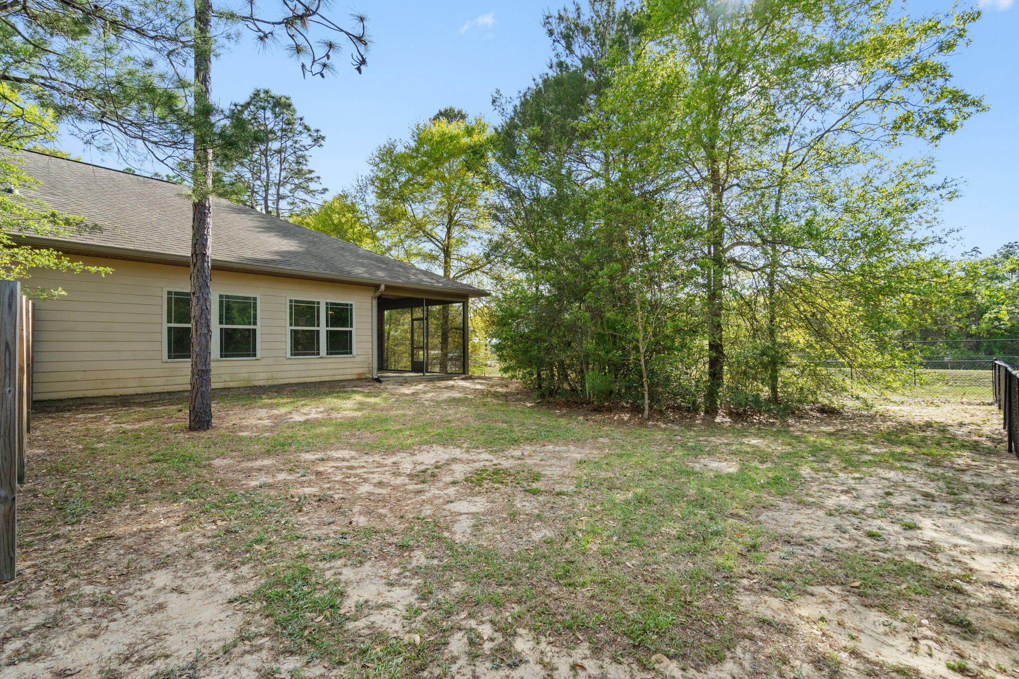 6000 Fiori Drive Crestview, FL 32539 - Photo 32 of 44 a view of a house with a yard