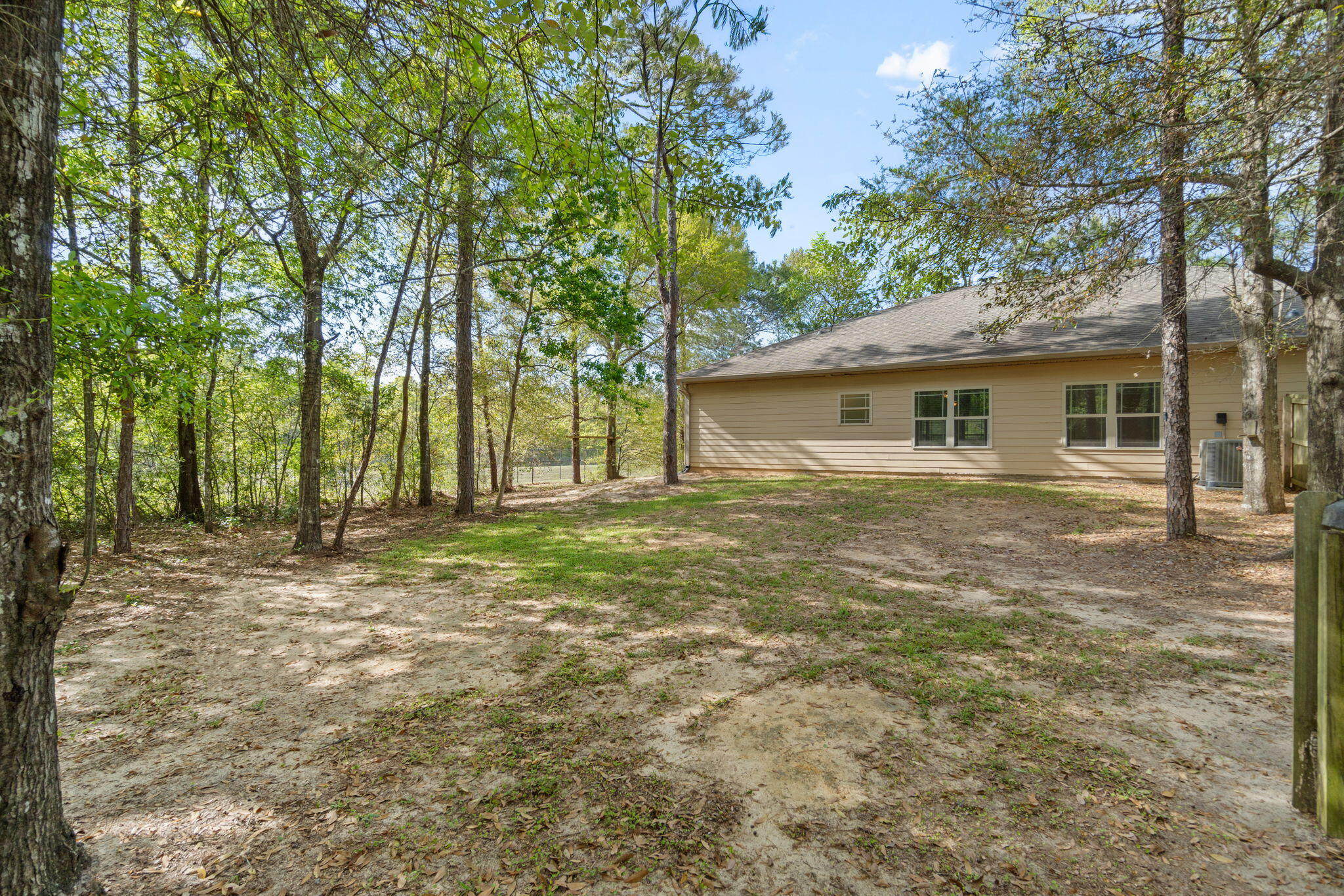 6000 Fiori Drive Crestview, FL 32539 - Photo 34 of 44 a house with trees in the background