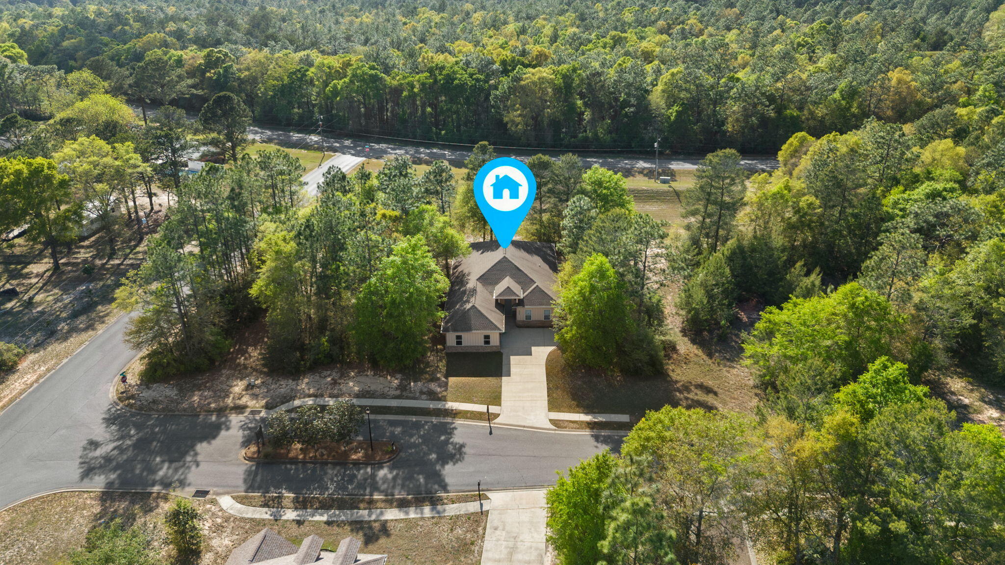 6000 Fiori Drive Crestview, FL 32539 - Photo 36 of 44 a backyard of a house with lots of green space