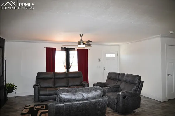 a living room with furniture and a flat screen tv