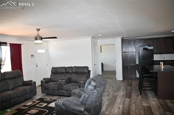 a view of a dining room with furniture and wooden floor