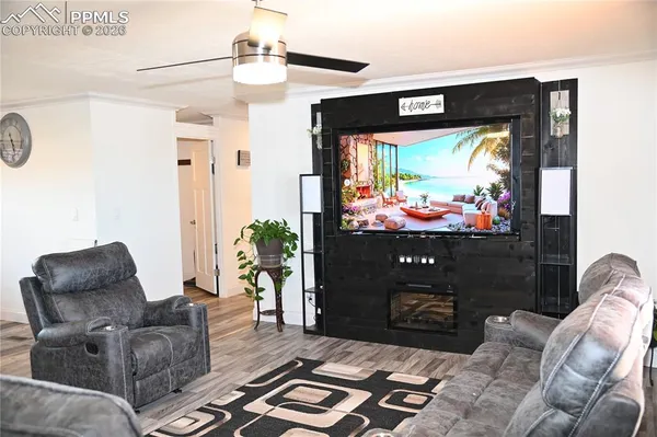 a kitchen with a refrigerator and a stove top oven