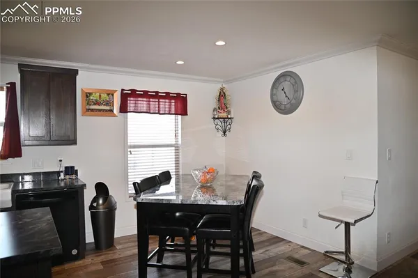 a kitchen with a sink a stove and cabinets