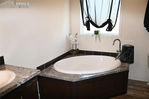 a bathroom with a shower and a tub