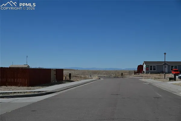 a view of a street with cars