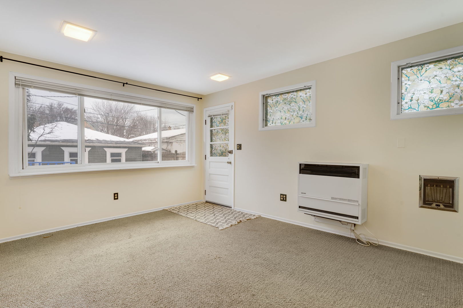 1927 Warren Street Evanston, IL 60202 - Photo 8 of 25 a view of an empty room with a window