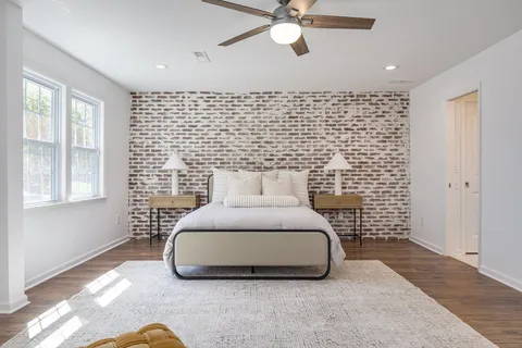 a bedroom with a bed and window