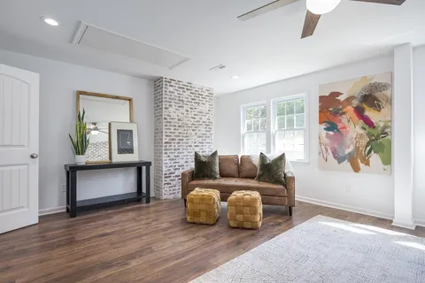 a living room with furniture and a window