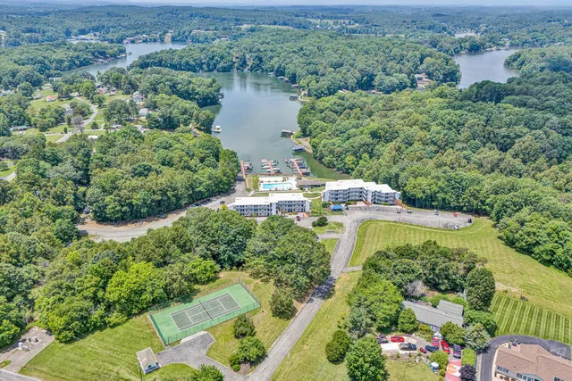 an aerial view of a house with a yard