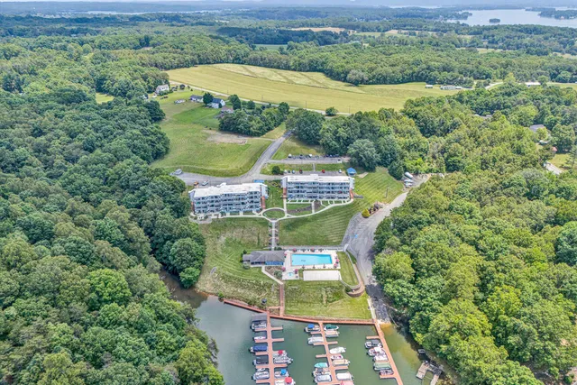a view of yard with swimming pool outdoor seating and green field