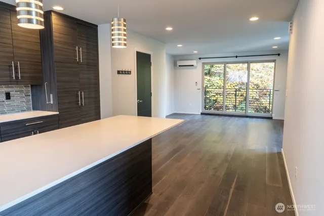 a room with wooden floor and window