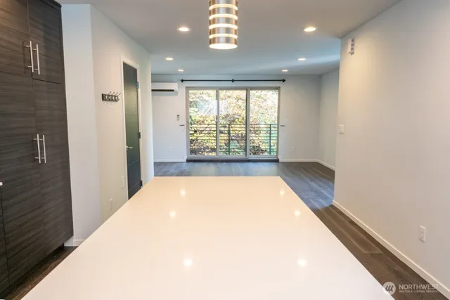 a view of an empty room and a window