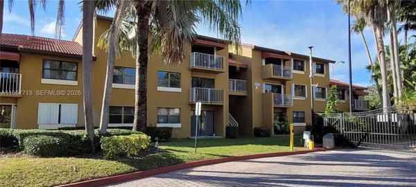 a view of a building with a yard