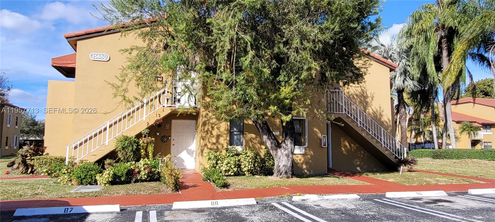 15650 Southwest 80th Street, Unit F208 Miami, FL 33193 - Photo 2 of 5 a view of a street with a building in the background