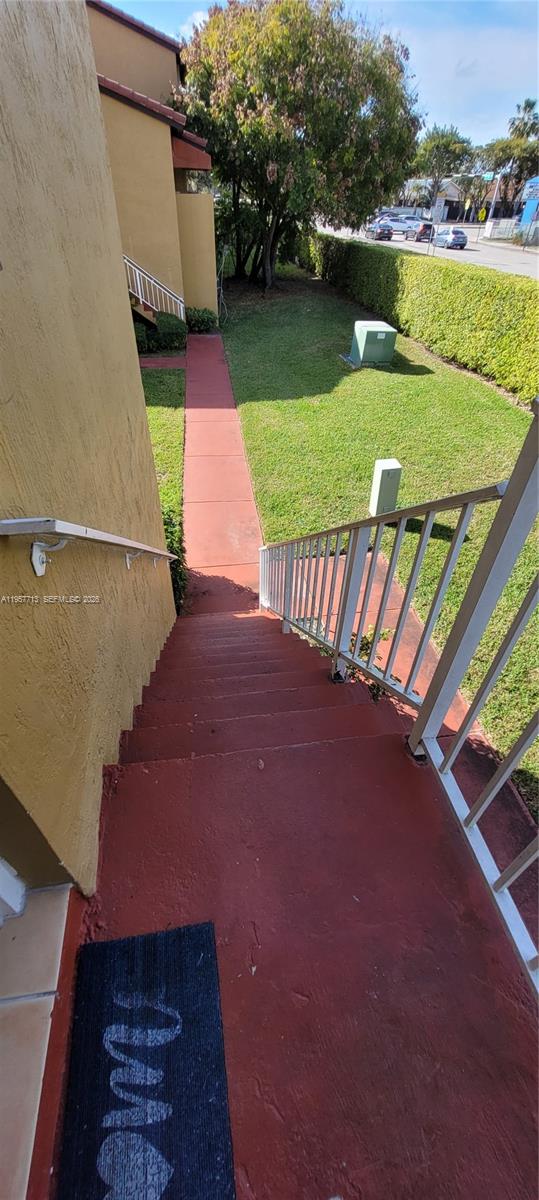 15650 Southwest 80th Street, Unit F208 Miami, FL 33193 - Photo 4 of 5 a view of outdoor space and yard