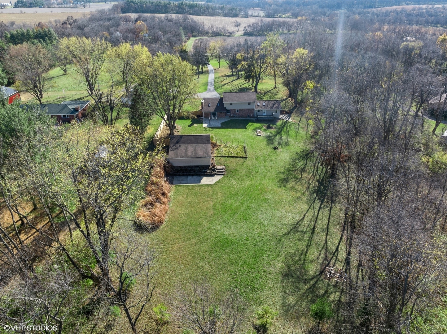 5881 Tipple Road Rockford, IL 61102 - Photo 11 of 32 a backyard of a house with lots of green space