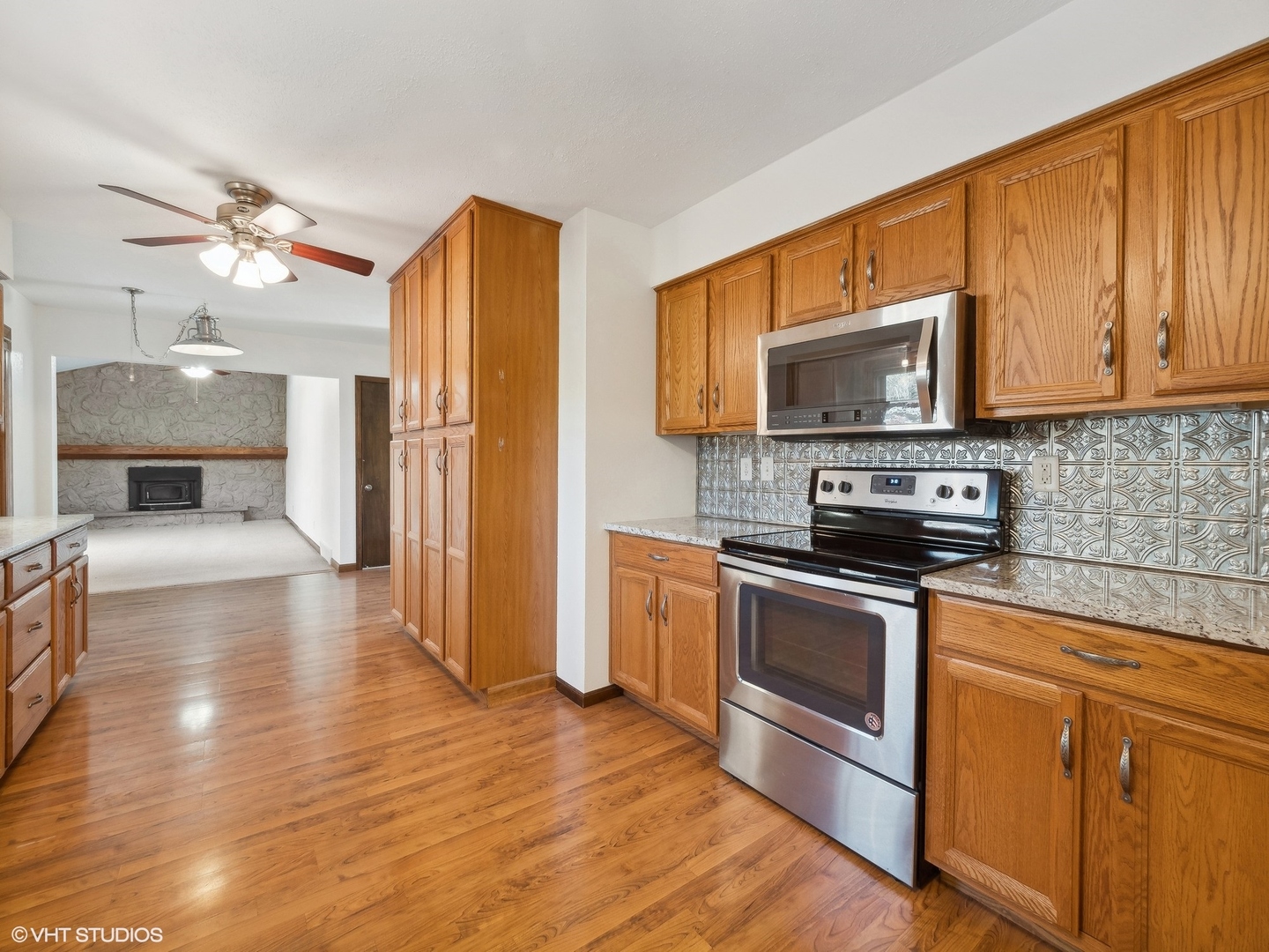 5881 Tipple Road Rockford, IL 61102 - Photo 16 of 32 a kitchen with stainless steel appliances a stove a microwave and sink