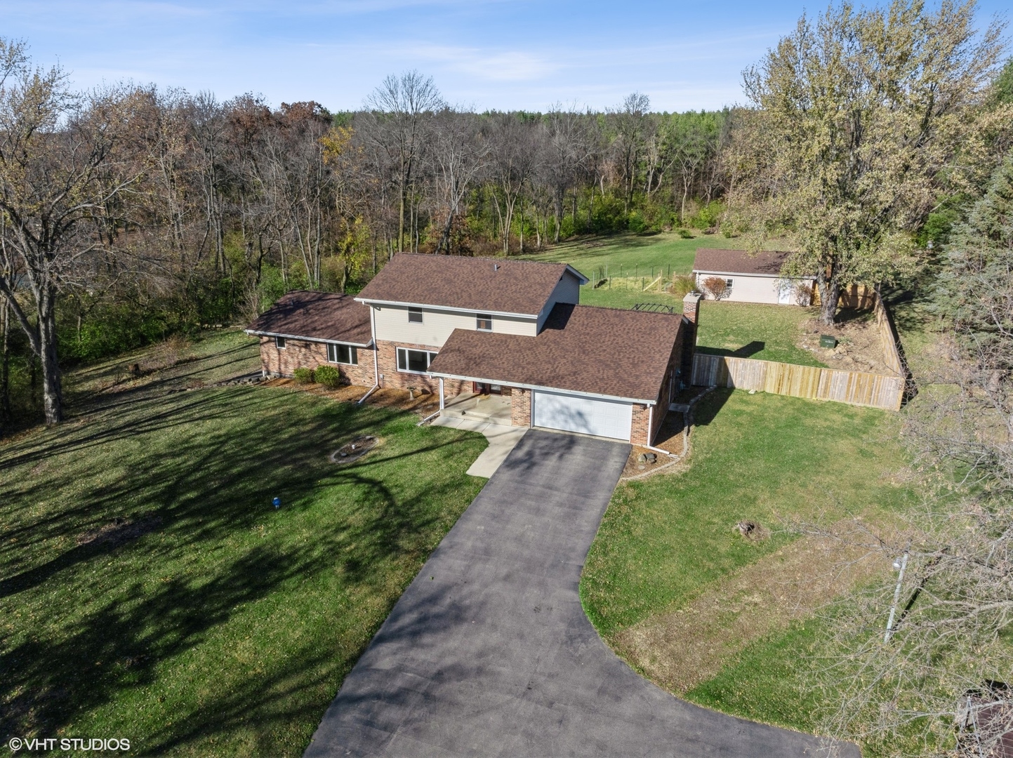 5881 Tipple Road Rockford, IL 61102 - Photo 2 of 32 an aerial view of a house with a yard