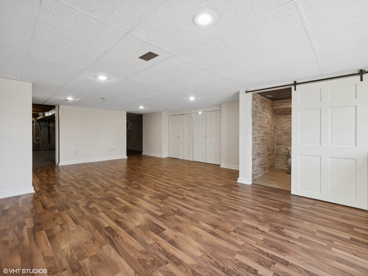 5881 Tipple Road Rockford, IL 61102 - Photo 30 of 32 a view of an empty room with wooden floor and a window