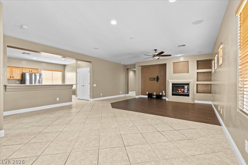 2627 Dirleton Place Henderson, NV 89044 - Photo 16 of 42 Whether hosting holiday dinners or relaxing with family, this spacious living and dining area adapts to your lifestyle.