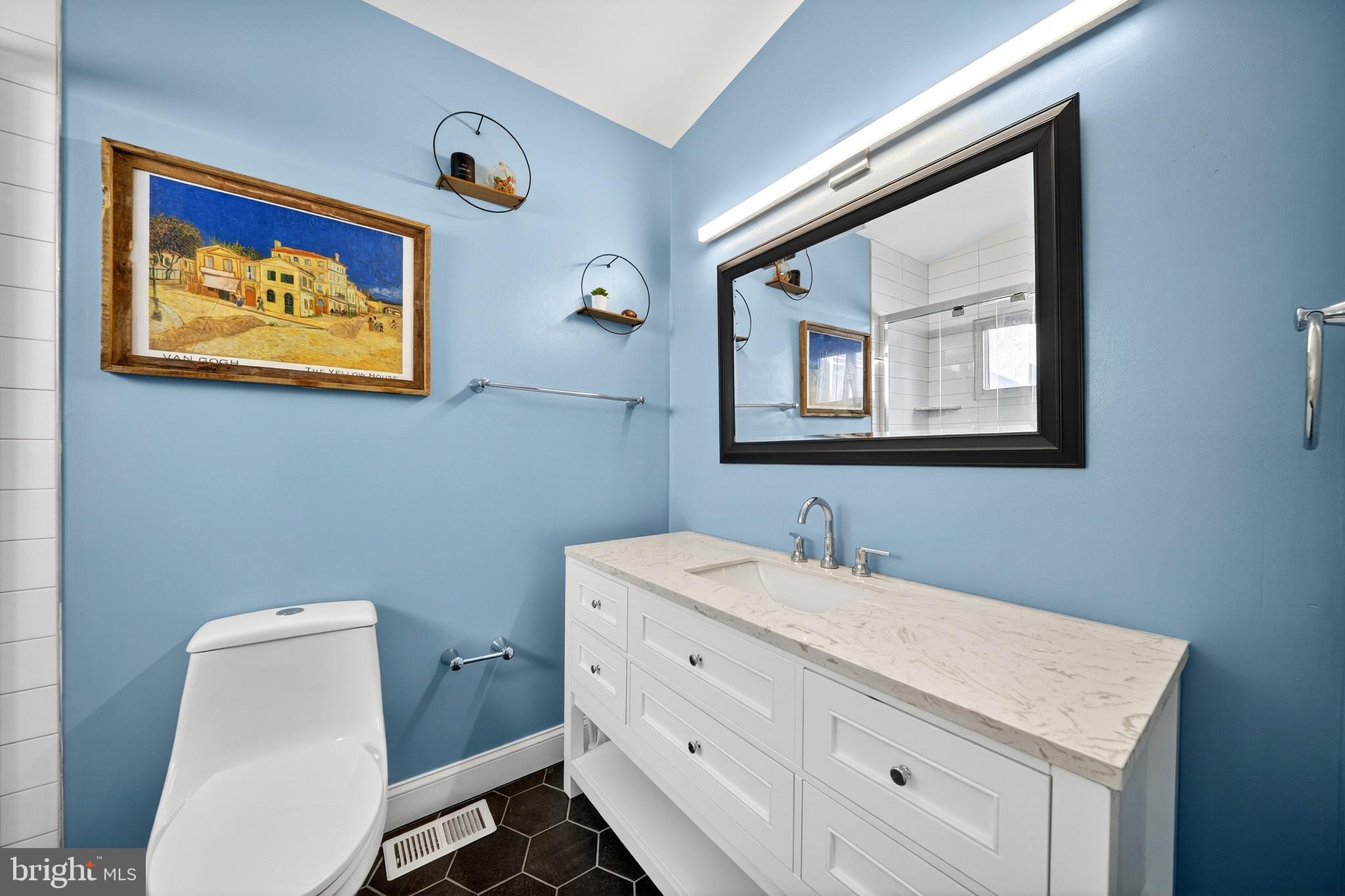 7 East Fort Avenue Baltimore, MD 21230 - Photo 11 of 73 a bathroom with a toilet a sink and mirror