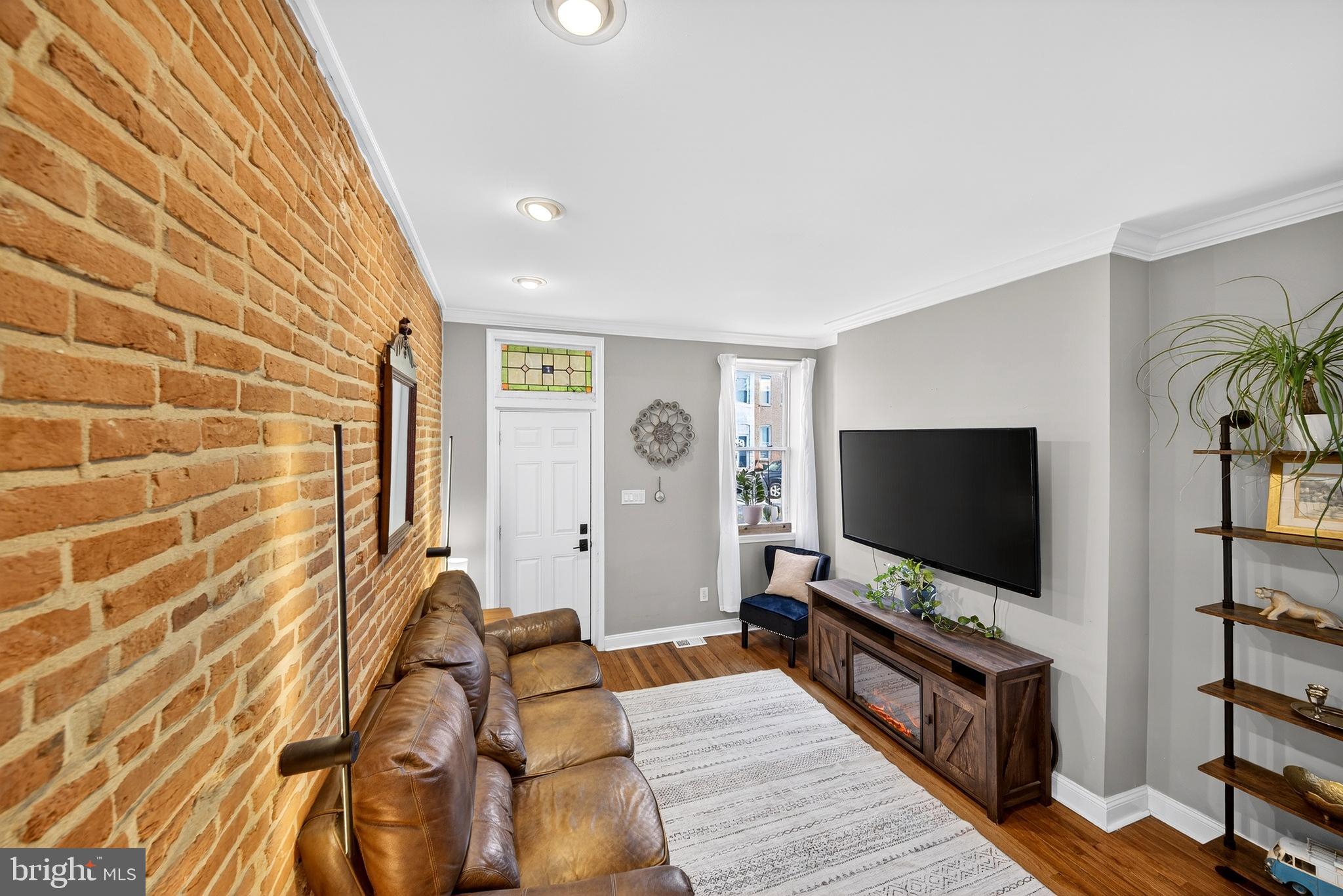 7 East Fort Avenue Baltimore, MD 21230 - Photo 16 of 73 a living room with furniture and a flat screen tv
