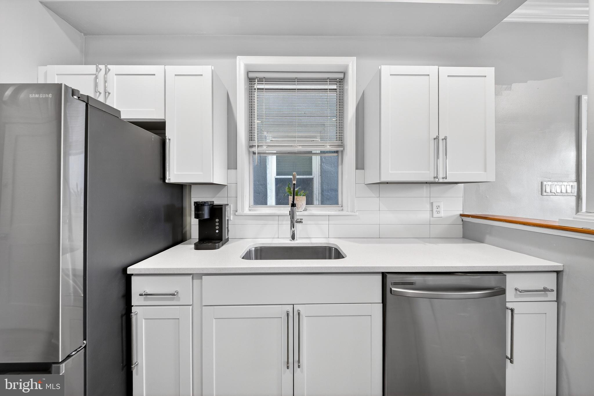 7 East Fort Avenue Baltimore, MD 21230 - Photo 19 of 73 a kitchen with a sink and a refrigerator