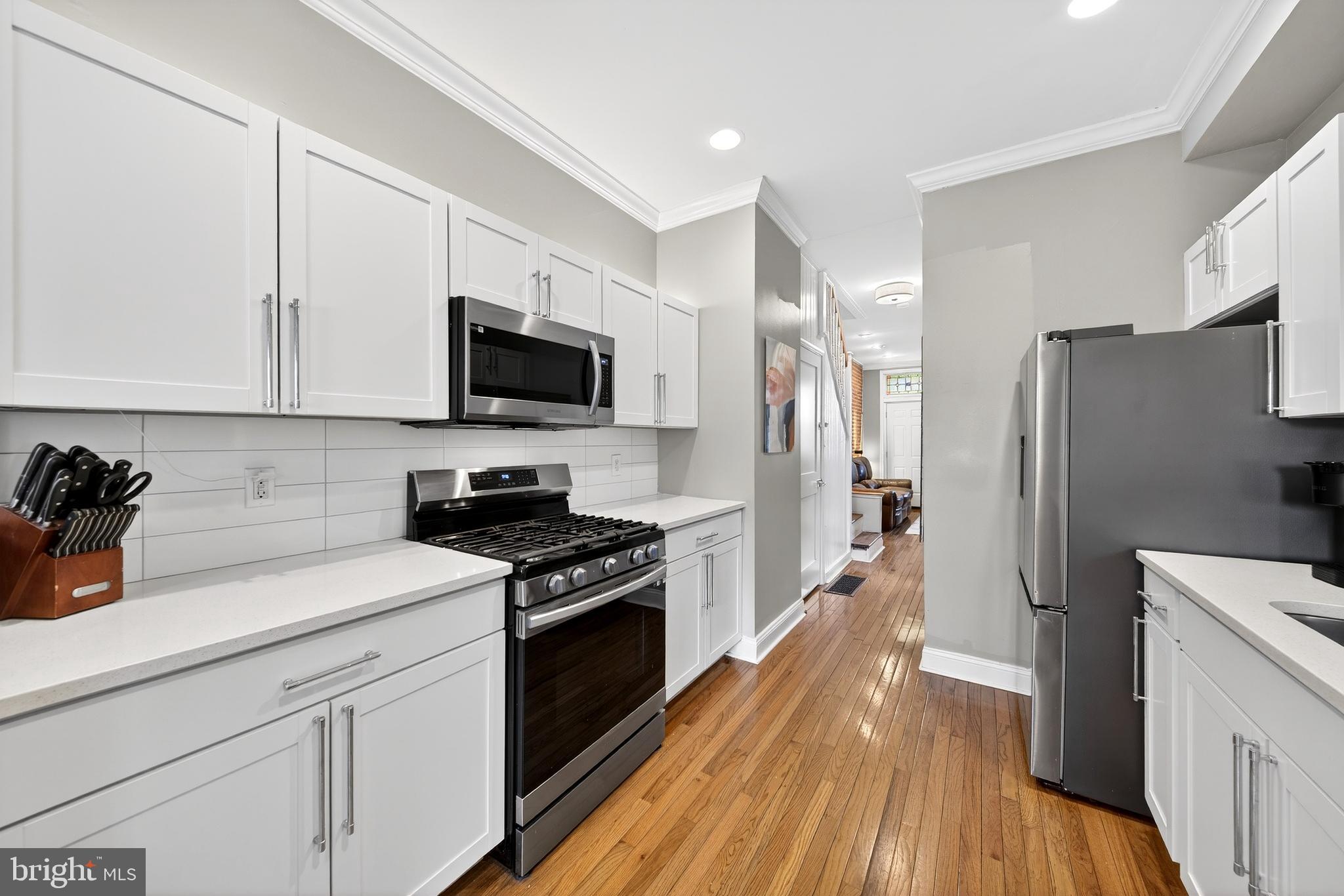 7 East Fort Avenue Baltimore, MD 21230 - Photo 21 of 73 a kitchen with a refrigerator stove and microwave