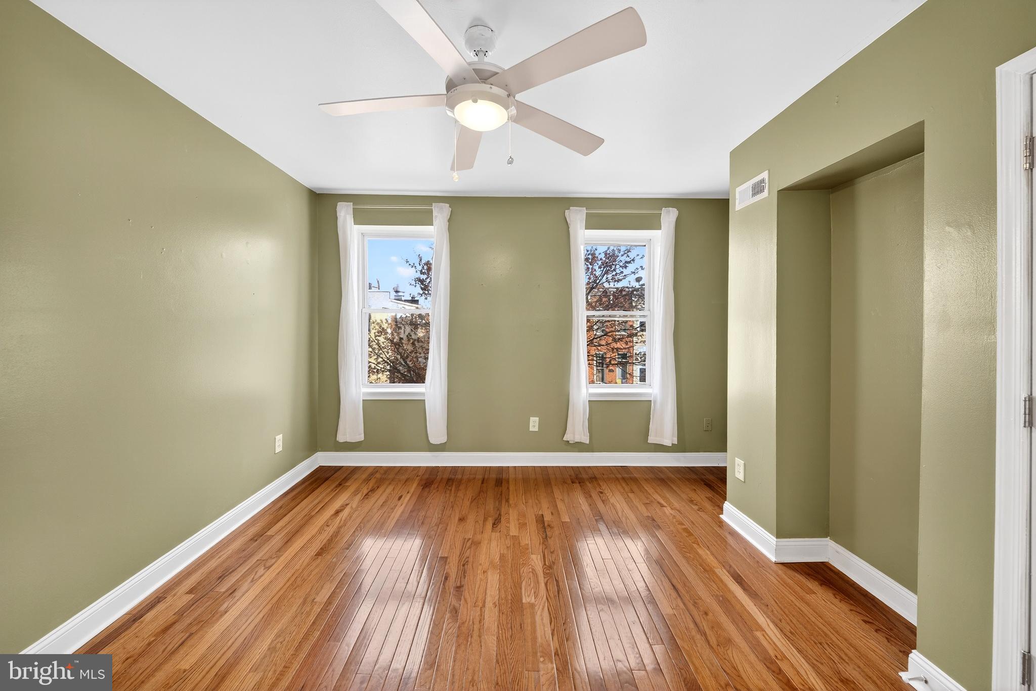 7 East Fort Avenue Baltimore, MD 21230 - Photo 33 of 73 wooden floor in an empty room with a window