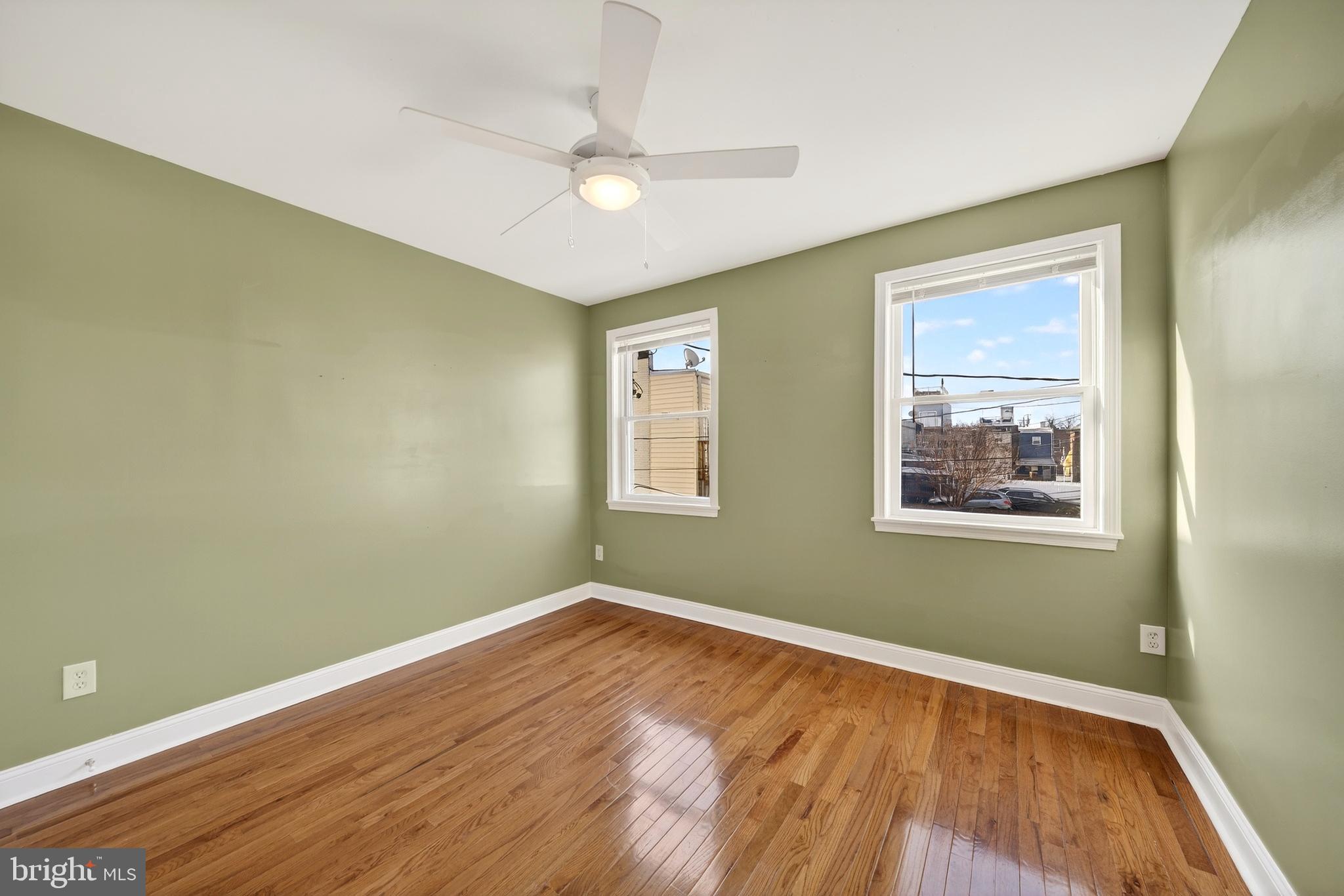 7 East Fort Avenue Baltimore, MD 21230 - Photo 36 of 73 a view of an empty room with wooden floor and a window