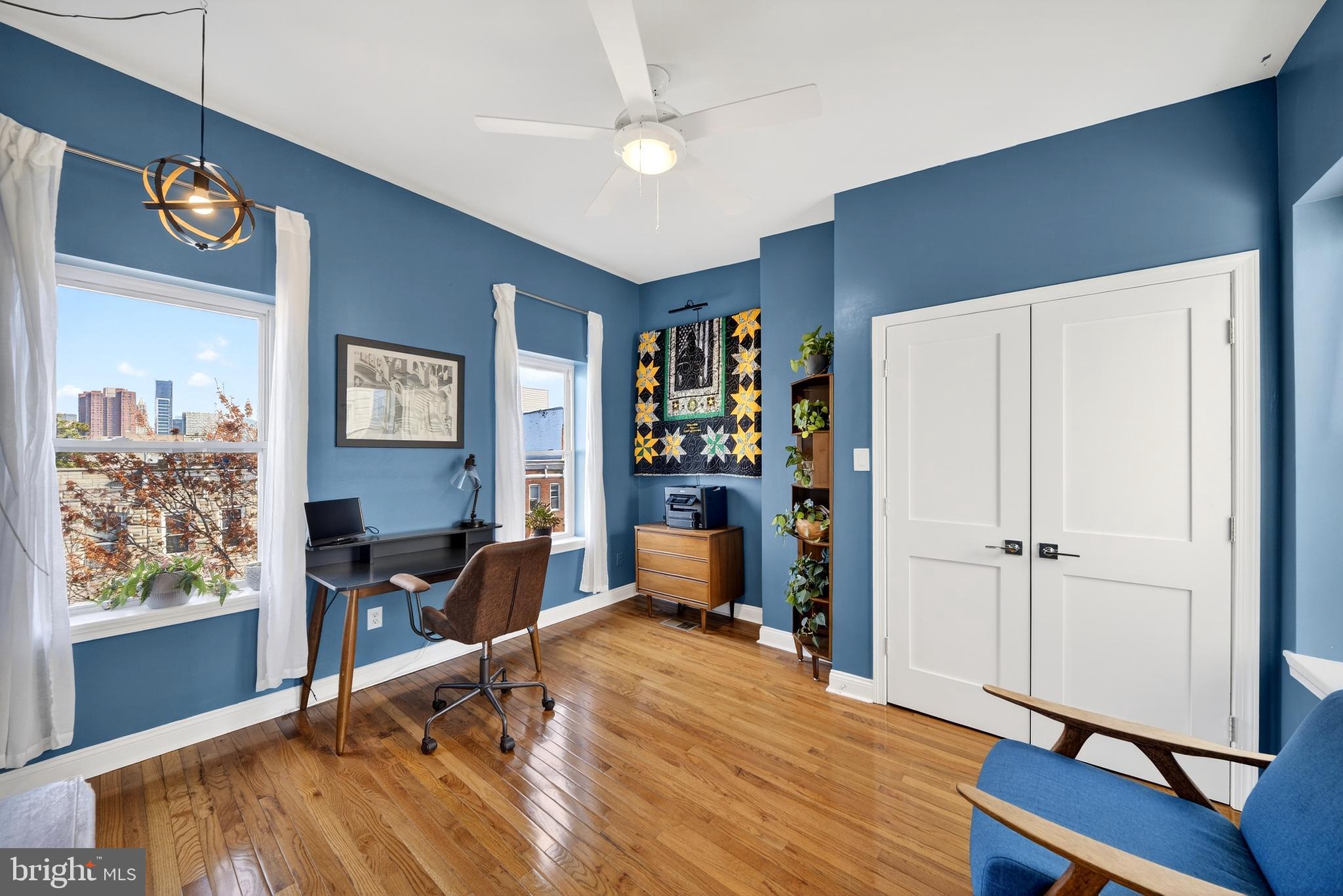 7 East Fort Avenue Baltimore, MD 21230 - Photo 7 of 73 a room with wooden floor and workspace