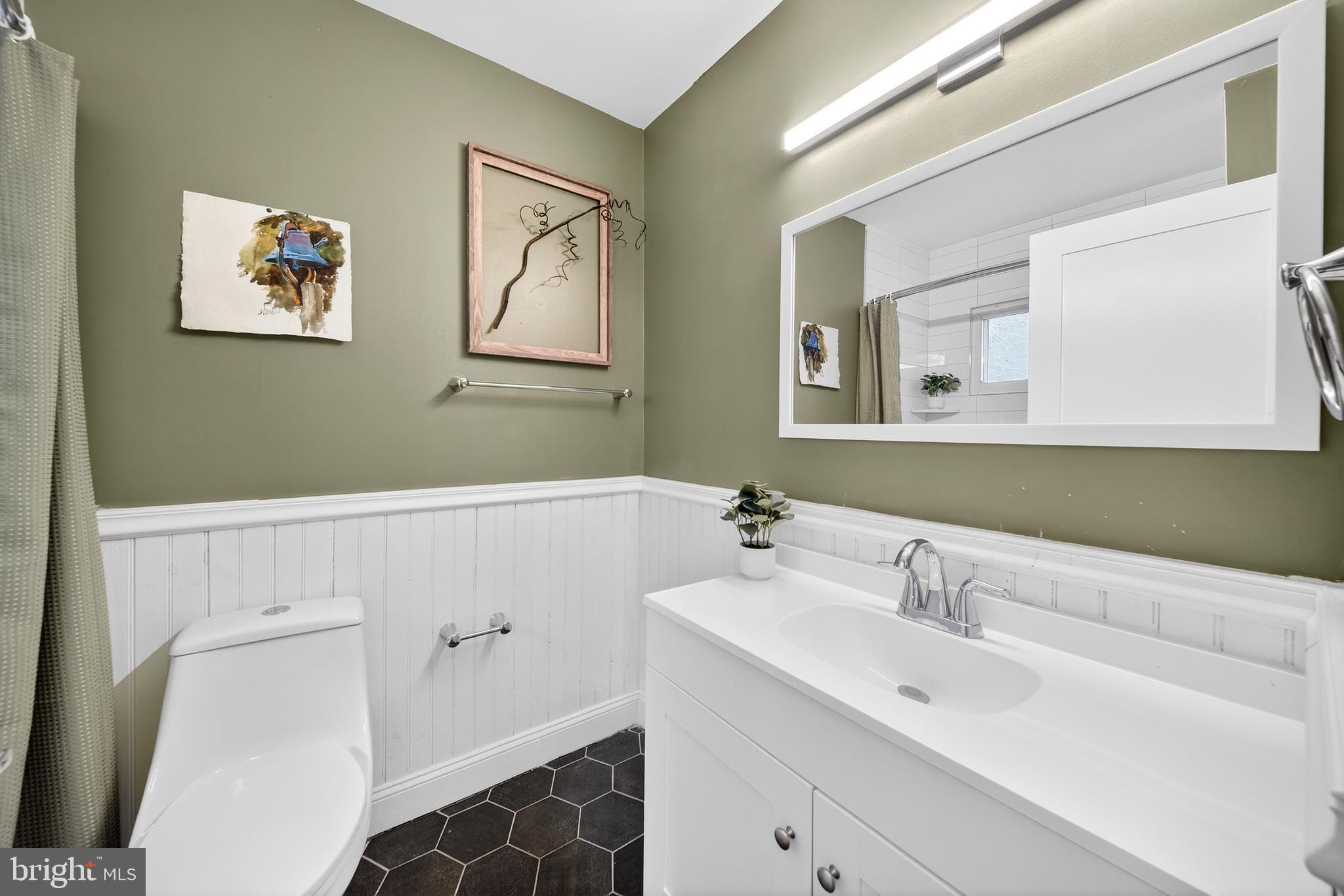 7 East Fort Avenue Baltimore, MD 21230 - Photo 10 of 73 a bathroom with a sink and a mirror