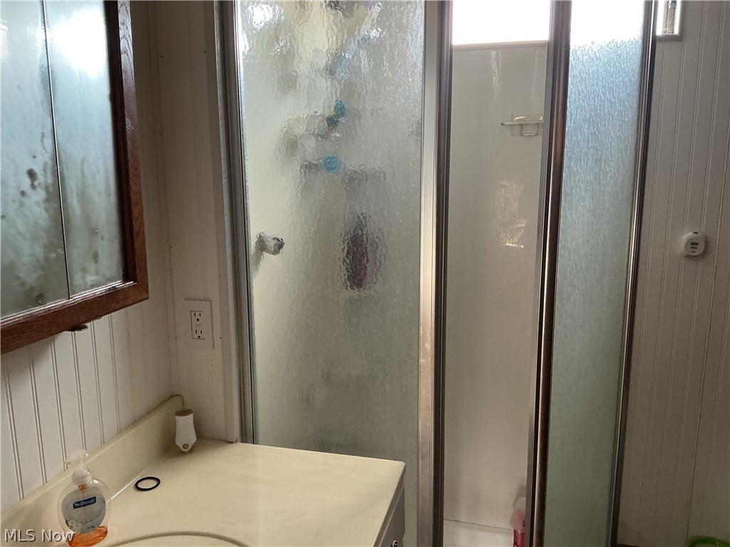 9385 North River Road East, Unit 33 Dresden, OH 43821 - Photo 19 of 19 Full bathroom featuring vanity and a stall shower